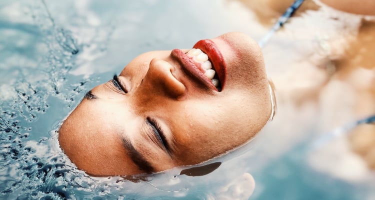 Woman's face sticking out of water