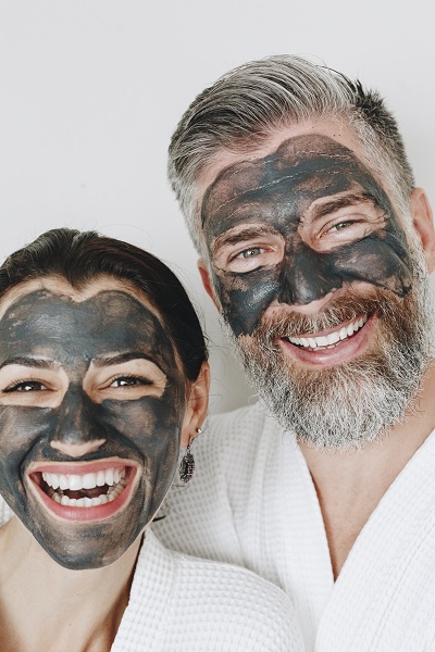 A couple wearing diy face masks at home