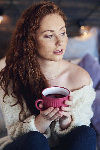 Beautiful woman drinking hot tea