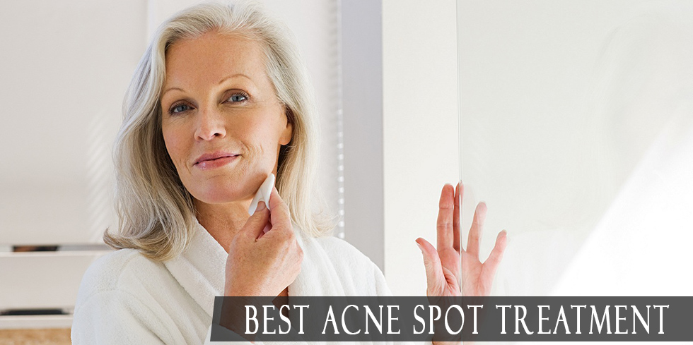 Mature woman trying on acne spot treatment before bed time