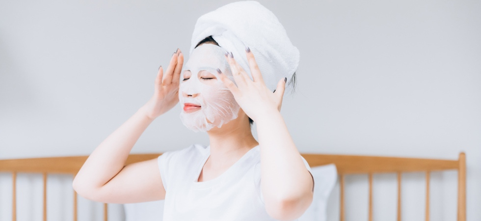 lady with facemask and towel