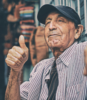 Old man giving thumbs up