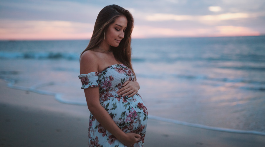 Pregnant woman on a beach