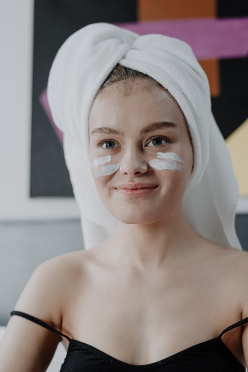 smiling woman with white towel